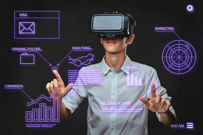 Teenager using virtual reality glasses with graph charts, numbers, lines.